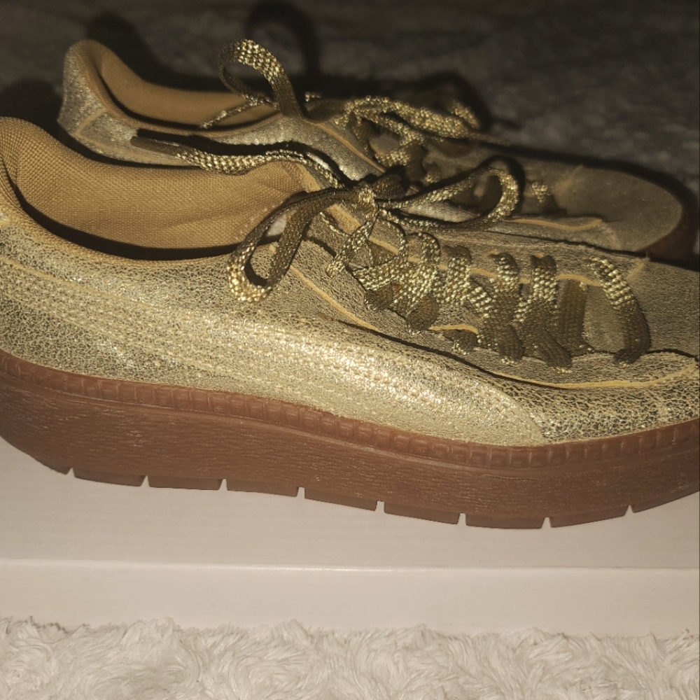 Gold Puma platform sneakers